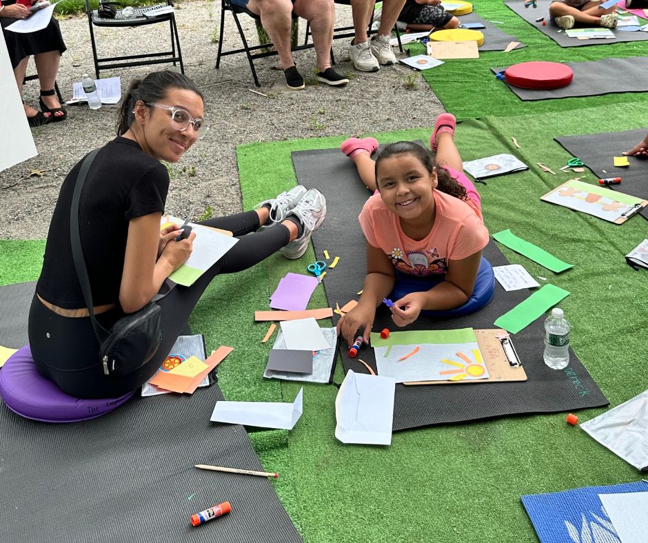 Mother and daughter showing their art work at Art in the Park 2024